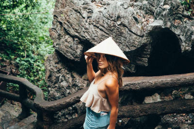 Woman looking back at camera with hat on
